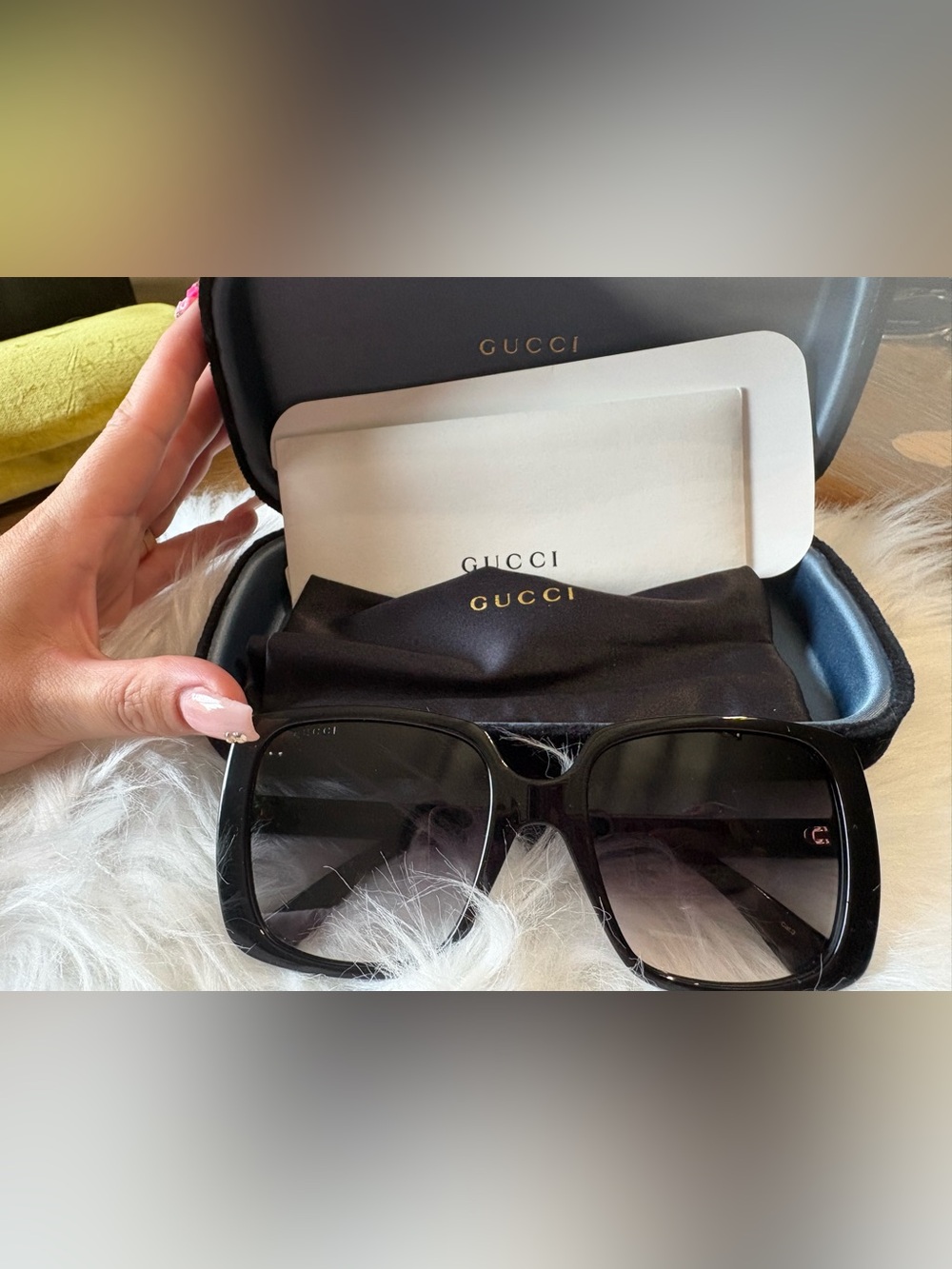 Gucci Black Frame Sunglasses with Gold Logo Detailing